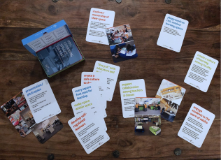 A table covered in the Learning Space Idea Kit cards. 