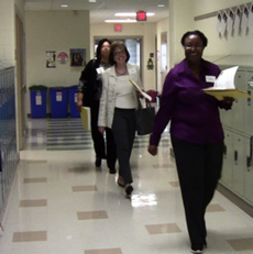 educators walking down a school hallway