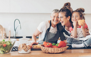 three generations of women in the kitchen hugging 