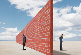 two people separated by a brick wall