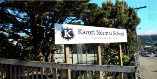 A photo from the video showing the Karori Normal School sign. 