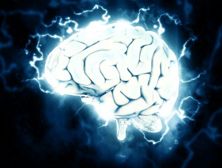 artistic rendering of human brain lit up bright white with electrical current visible